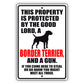 This property is protected by the good lord a border terrier and a gun aluminum metal sign