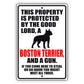 This property is protected by the good lord a boston terrier and a gun aluminum metal sign