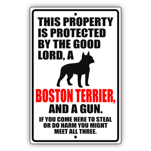 This property is protected by the good lord a boston terrier and a gun aluminum metal sign