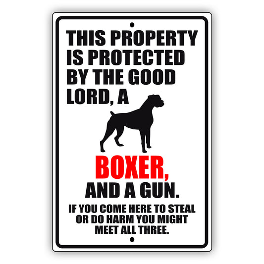 This property is protected by the good lord a boxer and a gun aluminum metal sign