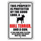 This property is protected by the good lord a bull terrier and a gun aluminum metal sign