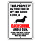 This property is protected by the good lord a dachshund and a gun aluminum metal sign