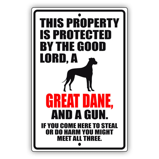 This property is protected by the good lord a great dane and a gun aluminum metal sign