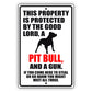 This property is protected by the good lord a pit bull and a gun aluminum metal sign