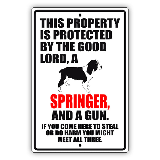 This property is protected by the good lord a springer and a gun aluminum metal sign