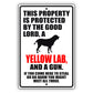 This property is protected by the good lord a yellow lab and a gun aluminum metal sign