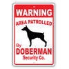 Warning Area Patrolled By Doberman Security Co. Dog Sign